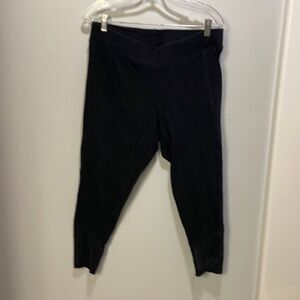 Torrid woman’s black Capri leggings with lace at the bottom